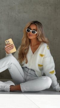 Ola Bianka's unbuttoned lemon jumper